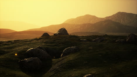 sunrise or sunset over a rocky meadow