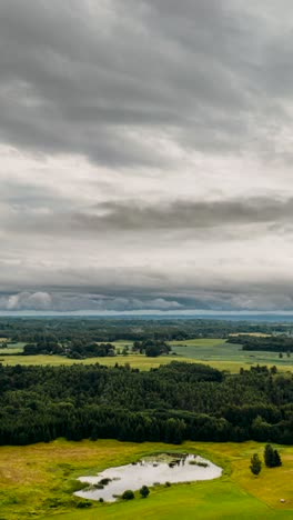 panoramic view of a lush green rural landscape under overcast sky