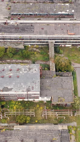 industrial big destroted factory. aerial view of factory constructions. vertical video