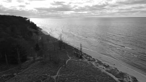 Slow-track-southward-on-the-shores-of-Lake-Michigan,-Grand-Haven-in-the-Distance