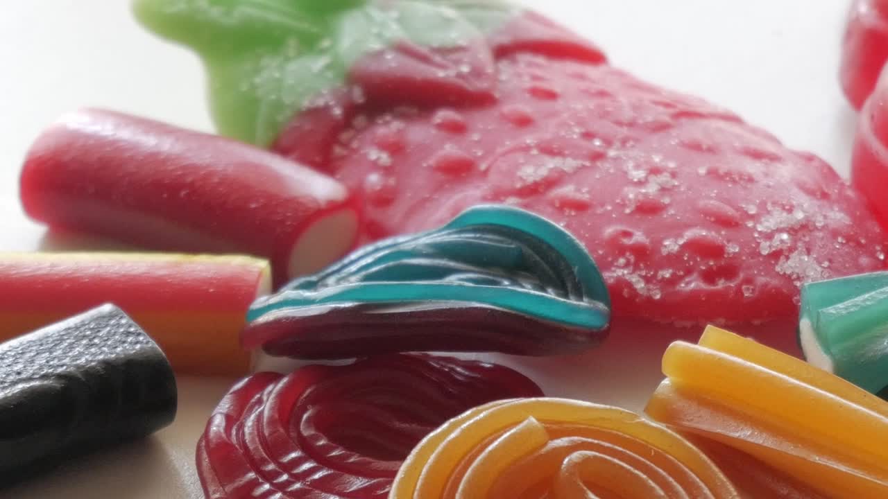 Vibrant candy assortment on a table, colorful sweets, cheerful mood