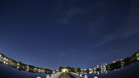 beautiful star trails over bridge in urban park at fukuoka city