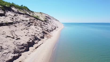 aerial beachline and sand dune ascent