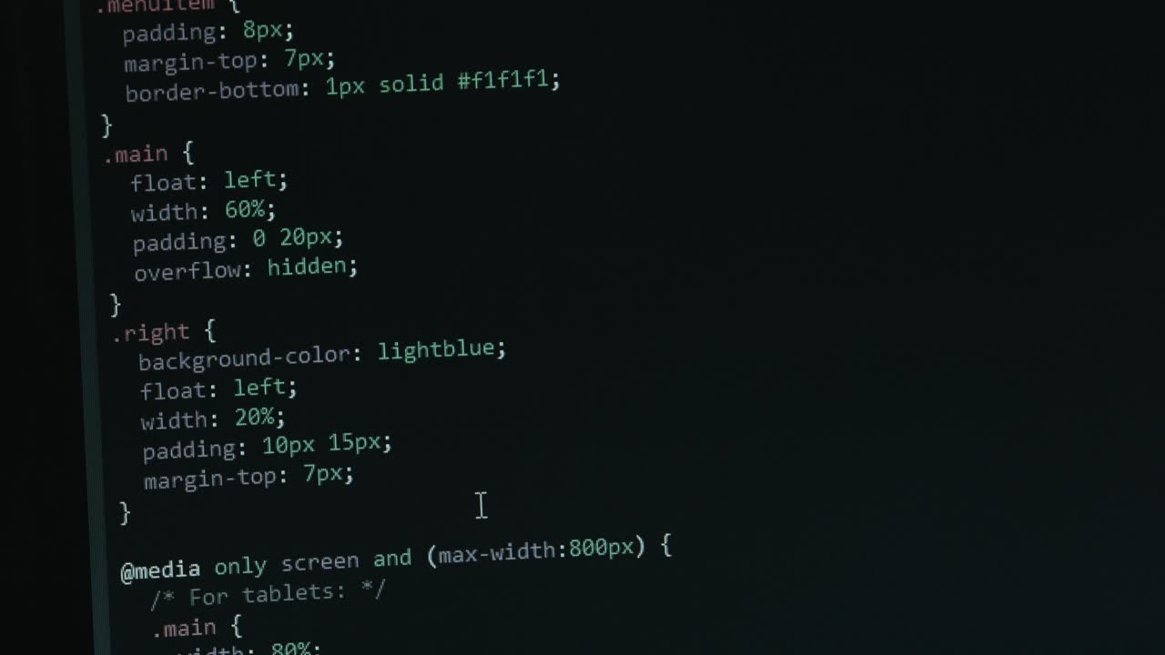 Close Up Code Screen with Different Colours Navigating Upwards with Pixel Details HTML