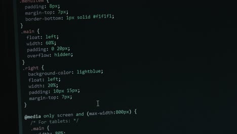 close up code screen with different colours navigating upwards with pixel details html
