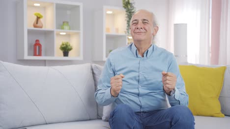 happy old man dancing to the camera.