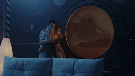family looks at mars through space window