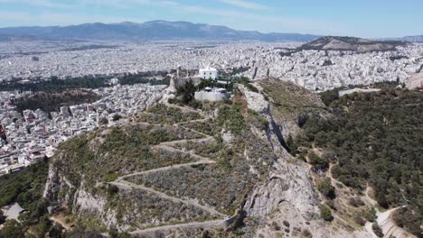 rising drone video of mount lycabettus, in athens, greece