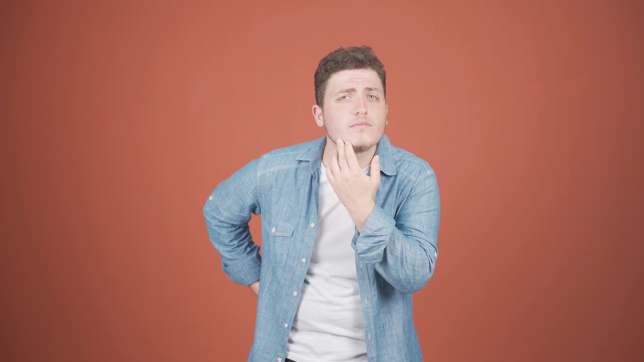 Man with wrinkles and problems on his skin is unhappy.
