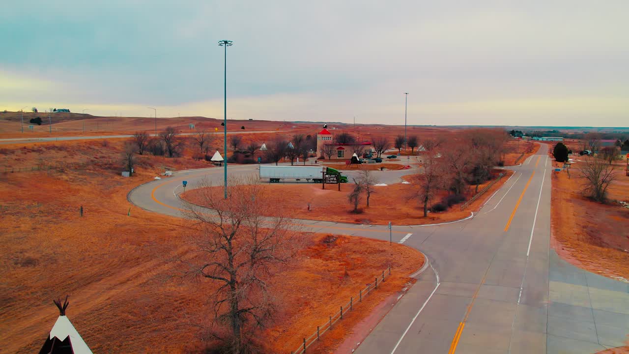 Colorado’s rest area featuring teepees, passing trucks, and rolling plains—an iconic southwestern pitstop for travelers.