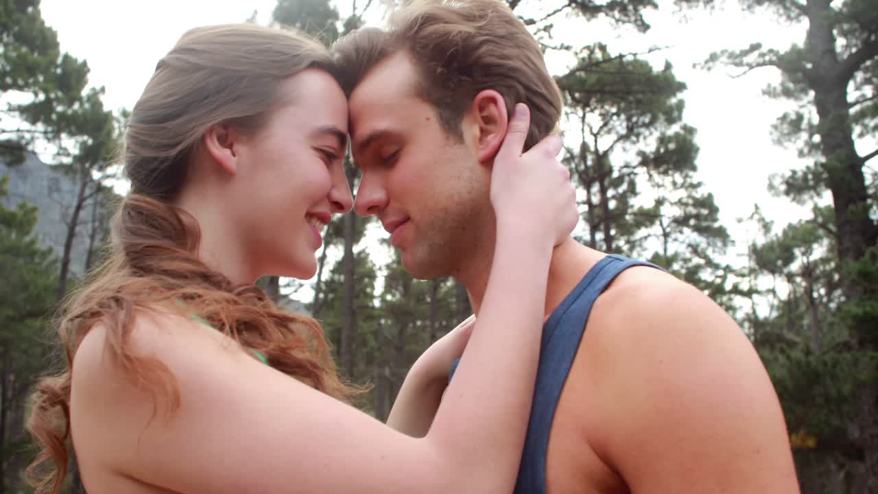 Happy couple hugging and looking at each other