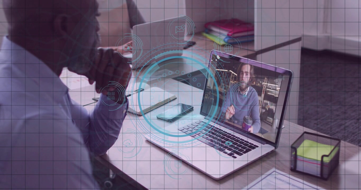 Mature office worker observing speaker on call and activating collaborative data overlays on laptop