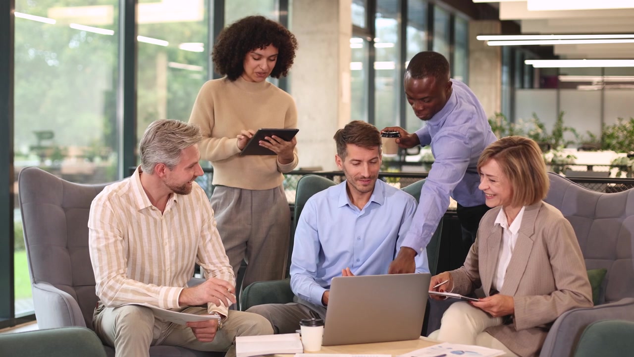 Diverse Business Team Collaborating in Modern Office Lounge