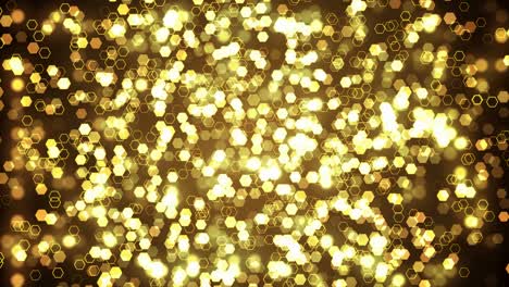 gold glitter hexagon sparkles on dark background. abstract animation.