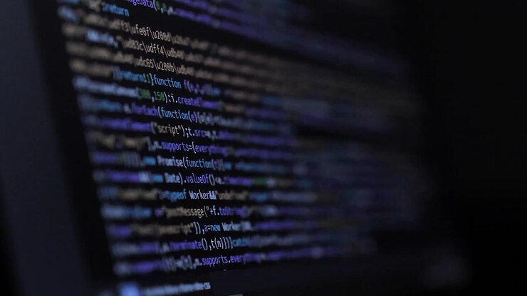 Developer is Browsing HTML Code on the Computer Screen. Side view. HTML Web Page Code Scrolling Programming, Abstract Technology Background for Software Developer, Computer Script Concept. Scene F.