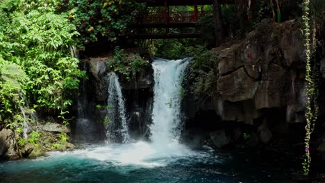 drone: dolly in of golgota waterfall at uruapan michoacan national park