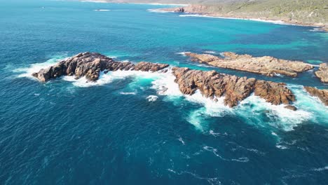 waves crashing into yallingup canal rocks tilt view, australia, slowmotion