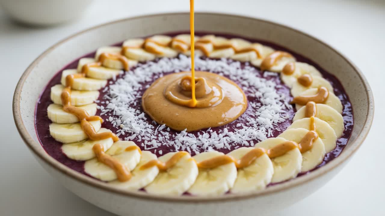 Deliciously Crafted Smoothie Bowl with Banana Slices, Nut Butter, and Coconut Flakes, Perfectly Arranged for a Vibrant and Healthy Breakfast Experience