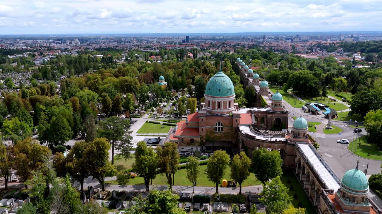 Aerial view of Mirogoj Cemetery in Zagreb, Croatia, drone rotate around the green domes,