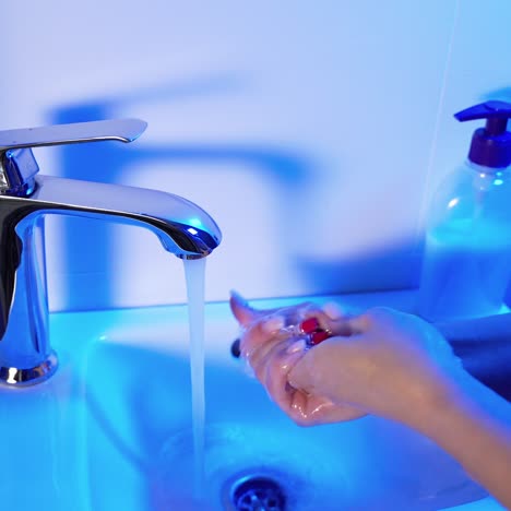 a woman is soaping her hands with soap. hygiene. cleaning hand. covid-19 prevention.