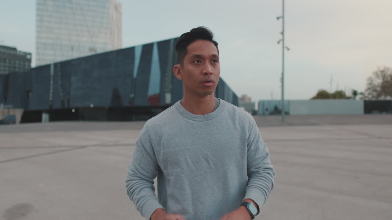 Man using smartwatch in urban setting