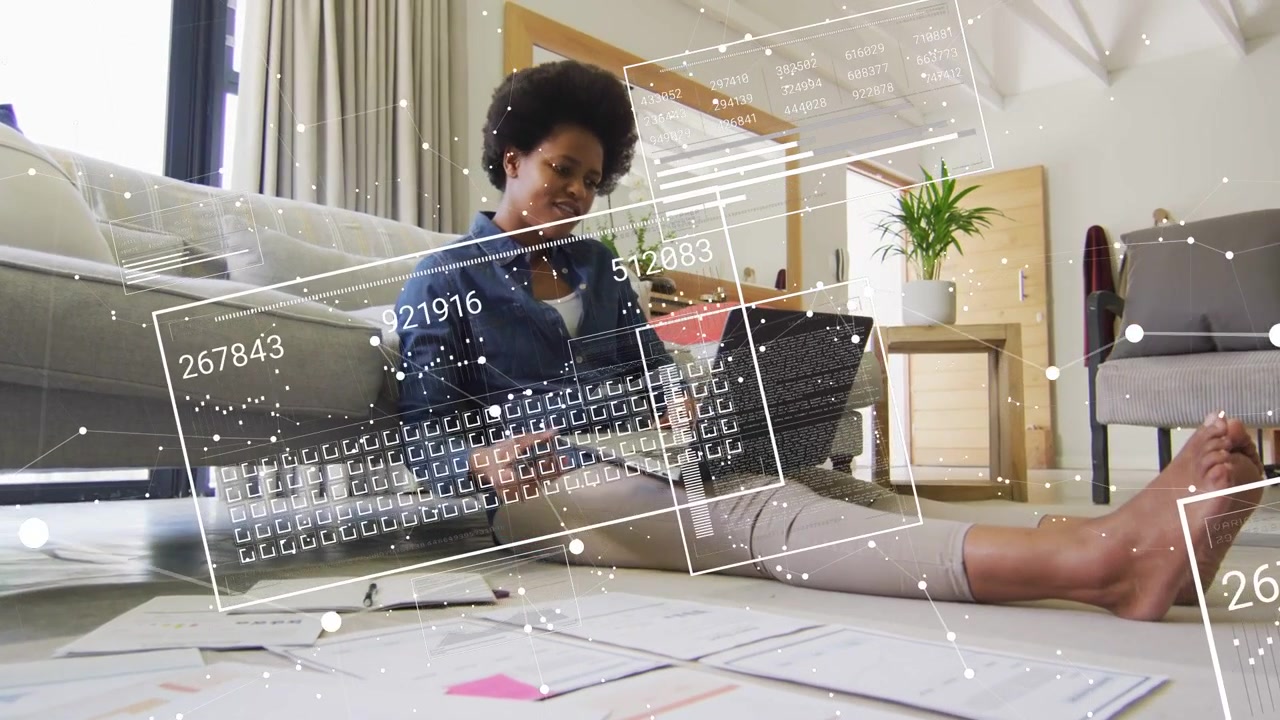 Woman doing business on floor, sorting papers, typing, lifting phone while data overlays appearing
