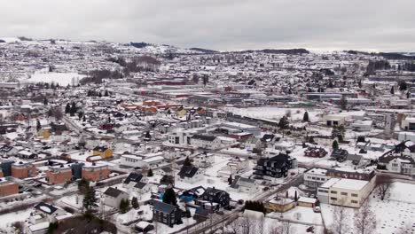 city gjovik in norway on winter day in a drone pull in shot