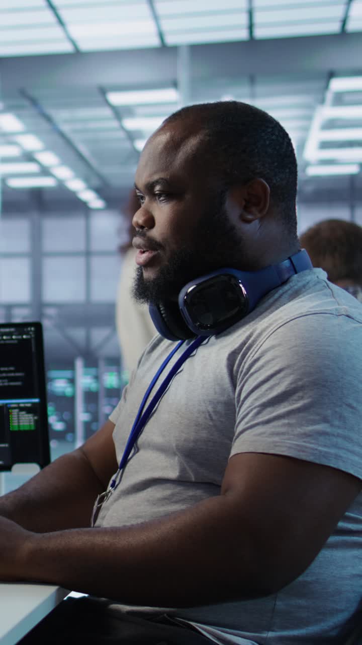 Vertical video Engineer tasked with monitoring data center supercomputers
