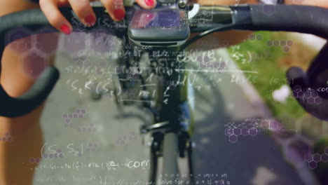 mathematical equations against woman setting speedometer on her cycle