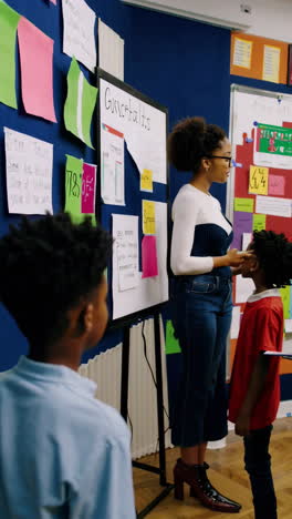 Teacher interacting with students in a classroom