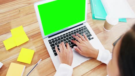 woman-using-laptop-in-office