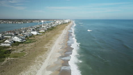 symmetric aerial view flying over wrightsville beach, north carolina shoreline