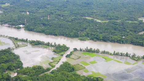 aerial landscape of overflown flooded river with agriculture land