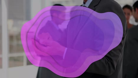 Animation-of-purple-stain-over-caucasian-businessman-using-smartphone