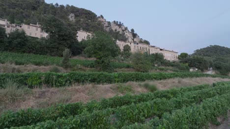 Aerial-Drone-shot-Vaucluse-Provence-Seguret-Medieval-Town-Vineyards-Sunset-France