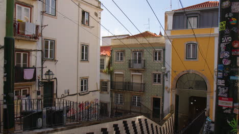 historic city with cable tramway track in lisbon, portugal