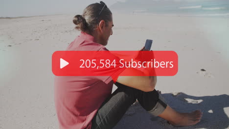 animation of speech bubble with subscribers text and numbers over man using smartphone on beach