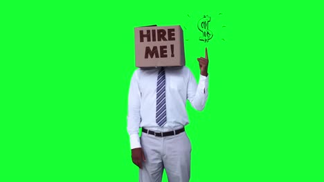 Businessman-wearing-hire-me-box-and-pointing-on-dollar-sign-against-greenscreen