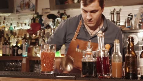 bartender making a cocktail at a bar