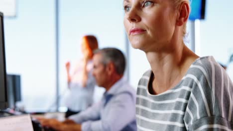 Female-executive-working-at-desk