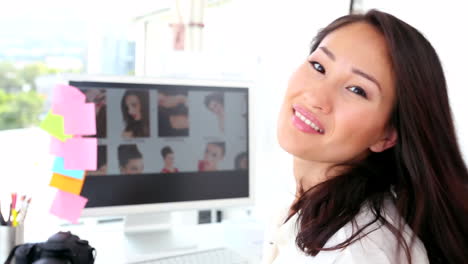 photo editor working at her desk