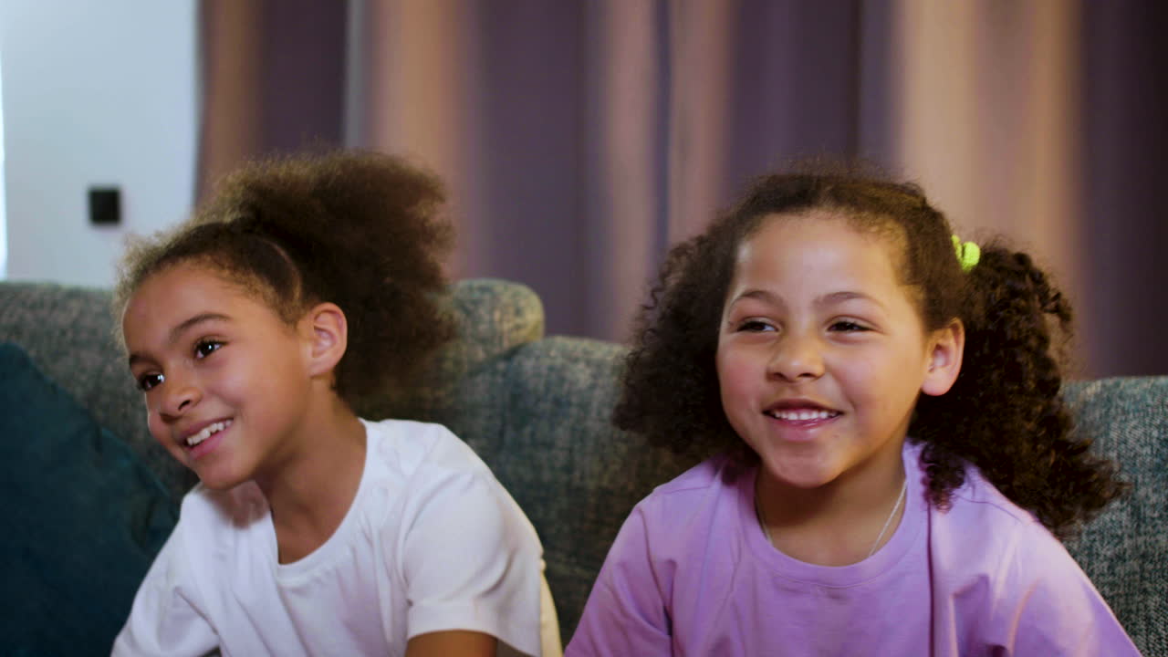 Kids watching film at home