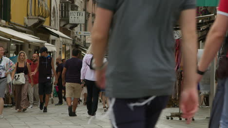 crowded street with people walking in a european city