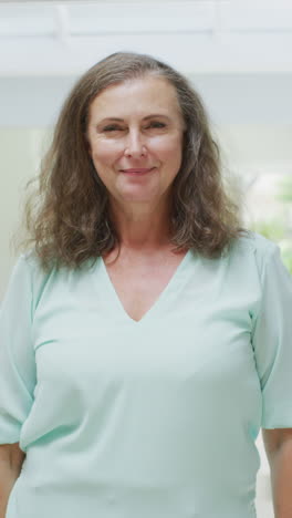 vertical video of portrait of happy caucasian woman at home
