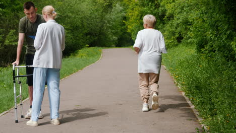 elderly person and support worker in the park