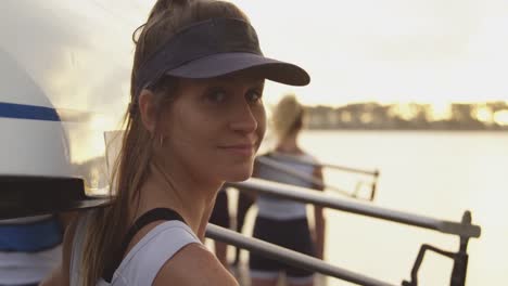 portrait of female rower by a river