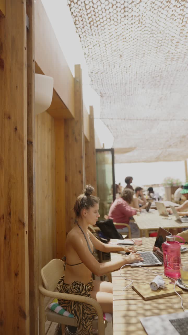 People working at an outdoor coworking space