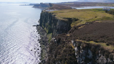 cliff on coast of skye on sunny day, scotland