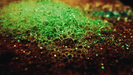 Abstract Macro of Green and Brown Bubbles with Glitter