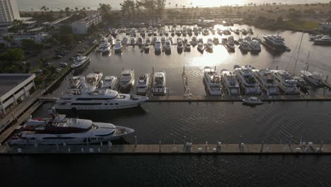 an aerial shot over 2 yachts parked in a ship yard on a sunny morning in south florida